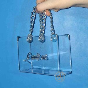Poseta, geanta mica din plexiglass transparent cu maner argintiu